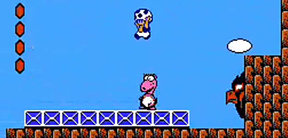 Screen capture of Super Mario Bros. 2, with Toady character leaping over a miniboss named Birdo