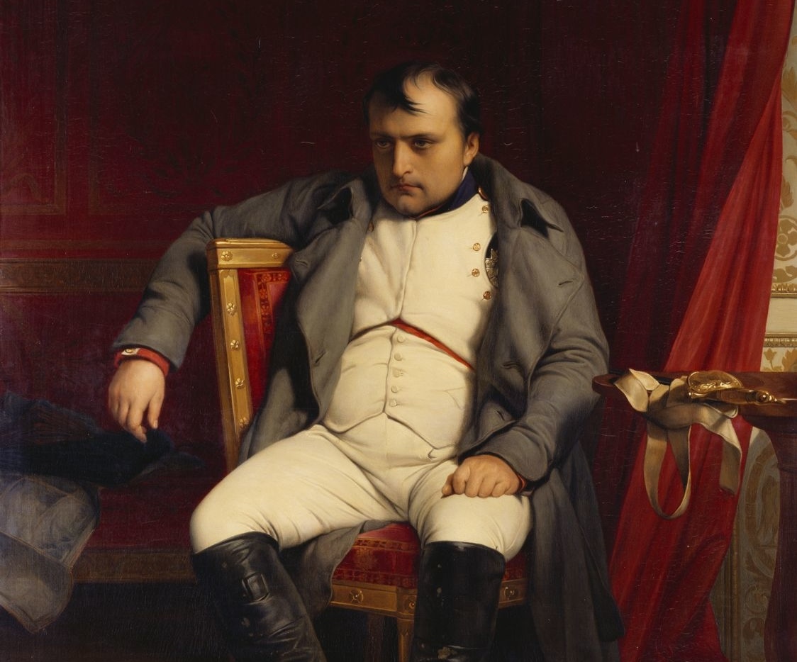 Napolean sitting slumped in a chair, staring at nothing