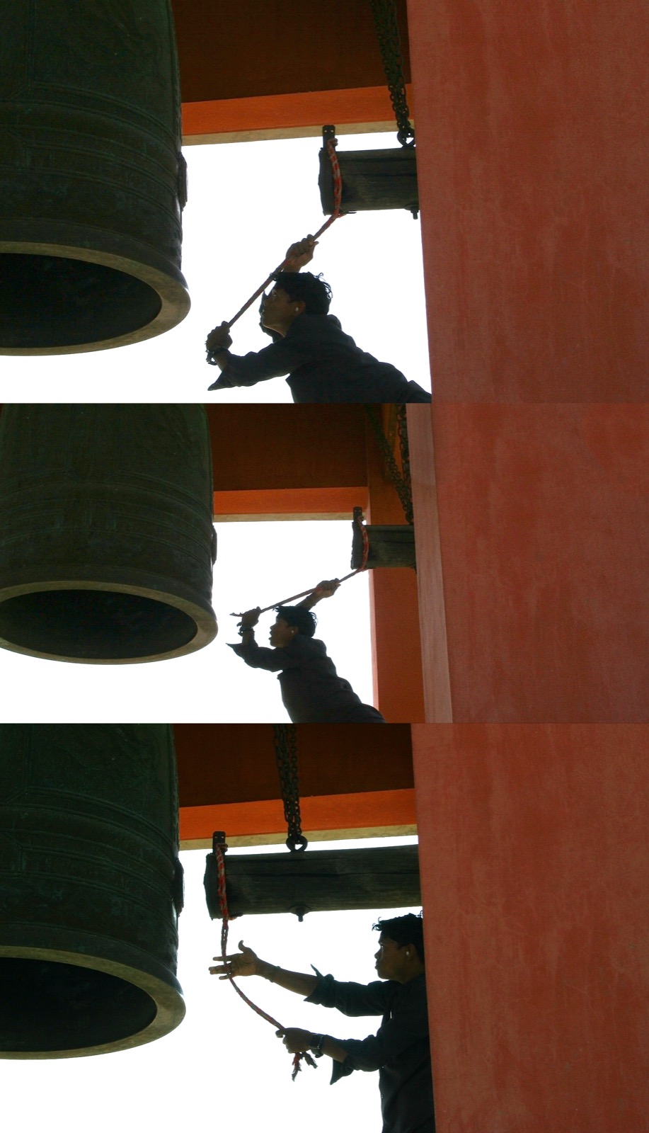 Three frames of a young man swinging a hanging wooden ram on a rope to strike a large bronze temple bell hung from a chain inside a red-walled bell pavilion