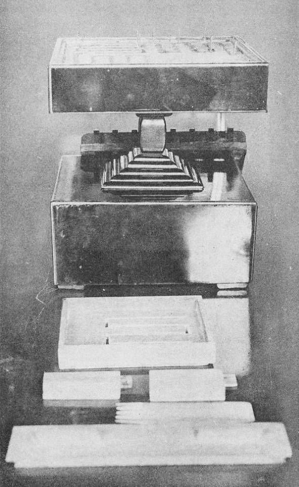 A late-Edo-period Japanese incense clock: a flat lacquered tray with a stencil-cut spiral path for powdered incense, with hour markers along it