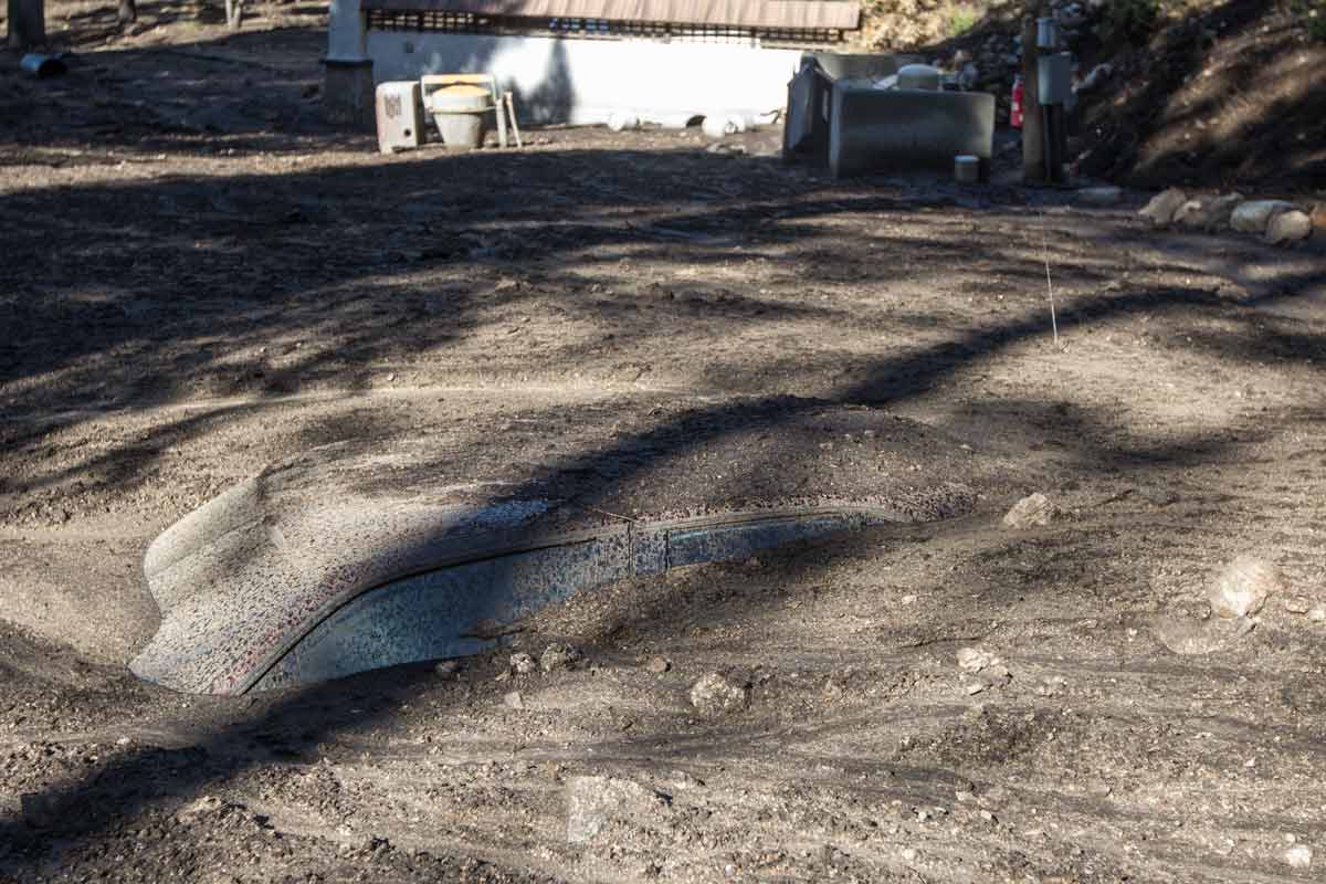 Car buried under mud at Zen Mountain Center